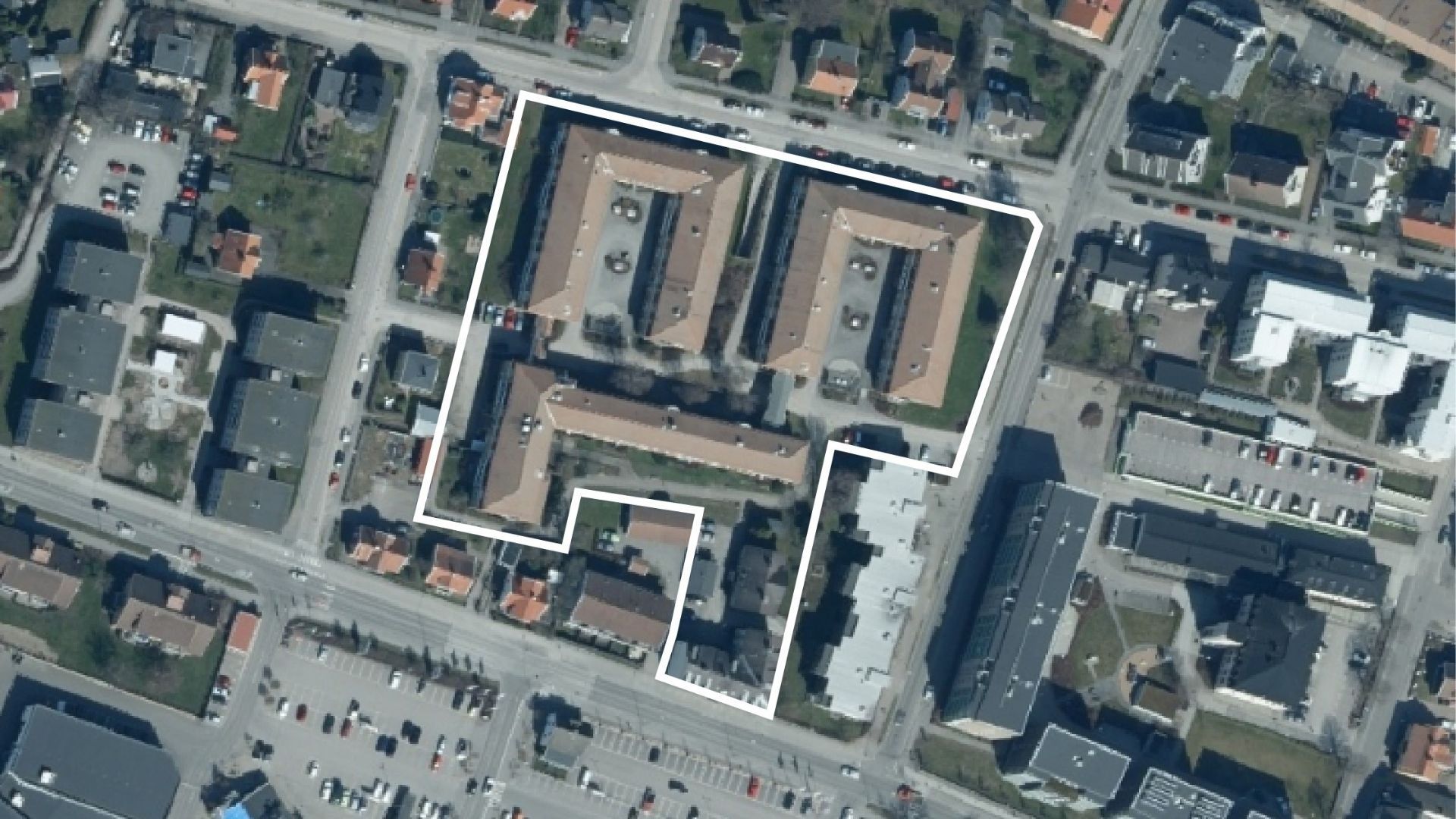 Flygbild över kvarteret trädgården med utritade gränser.